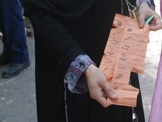 a voter in charsadda shows a torn ballot paper photo sameer raziq express