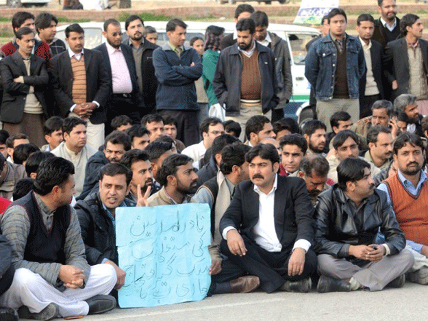 nadra starts their sit in in front of the regional office of nadra in karachi photo express file