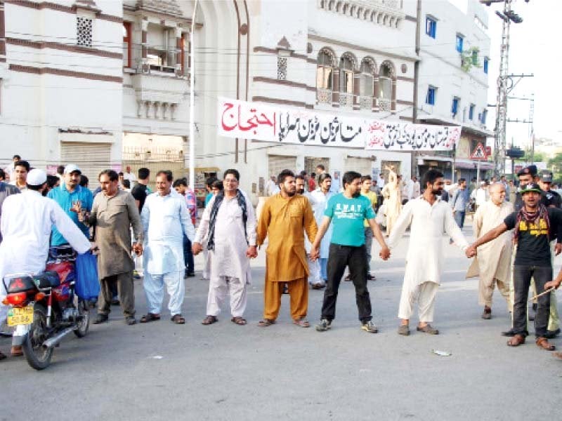 the protesters holding hands to block the mall for traffic photo abid nawaz express