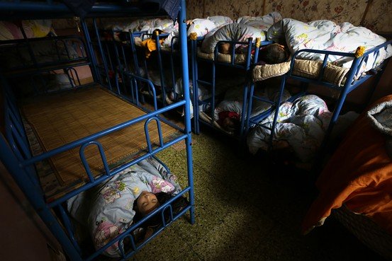 children sleep in a dormitory at a kindergarten a school for children of migrant workers on the outskirts of beijing photo reuters