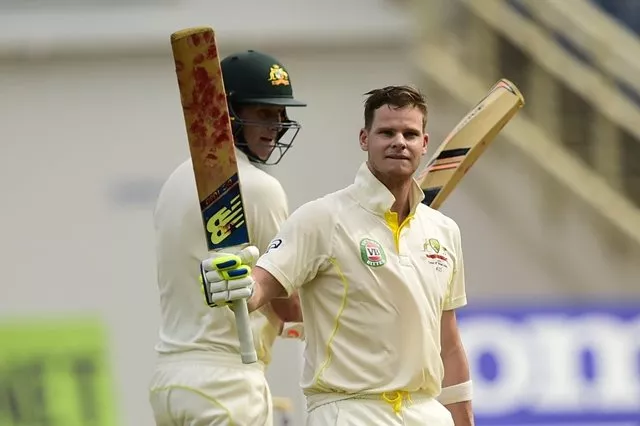 australia 039 s steve smith reacts after scoring 100 runs on the first day of the second cricket test between australia and the west indies june 11 2015 at sabina park in kingston jamaica at left is smith 039 s batting partner adam voges photo afp australia 039 s steve smith reacts after scoring 100 runs on the first day of the second cricket test between australia and the west indies june 11 2015 at sabina park in kingston jamaica at left is smith 039 s batting partner adam voges photo afp