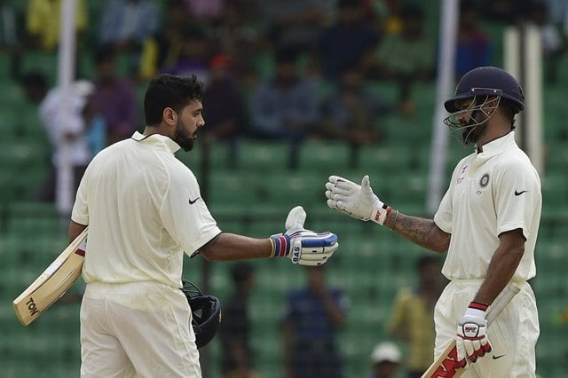 india 039 s murali vijay l celebrates his century with teammate shikhar dhawan during the third day of the cricket test match between bangladesh and india at khan shaheb osman ali stadium in narayanganj on june 12 2015 photo afp india 039 s murali vijay l celebrates his century with teammate shikhar dhawan during the third day of the cricket test match between bangladesh and india at khan shaheb osman ali stadium in narayanganj on june 12 2015 photo afp