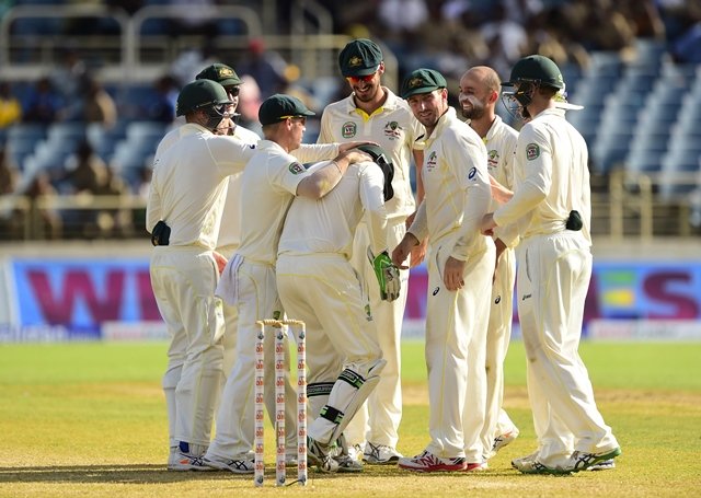 australian cricketers gather around wicketkeeper brad haddin after west indies 039 shai hope was dismissed on the second day of the second cricket test between australia and the west indies june 12 2015 at sabina park in kingston jamaica it was the third wicket for australia 039 s nathan lyon 2r photo afp