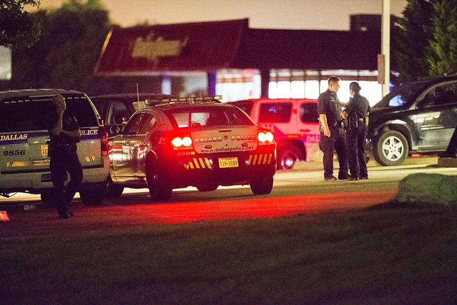 officers gather near the intersection of interstate 45 and palestine street where police have cornered a suspect in a van on saturday in hutchins photo courtesy the dallas morning news