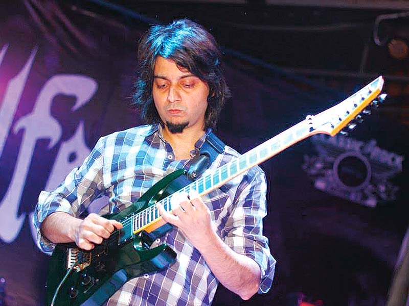 faraz anwar plays an electrifying guitar solo during hellfest 2014 photos publicity