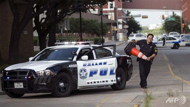 dallas police close off streets around the police department following the early morning shooting in dallas texas june 13 2015 photo afp