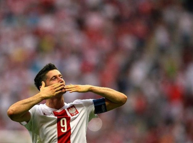 robert lewandowski of poland reacts after scoring a goal during the euro 2016 group d qualifying football match poland vs georgia in warsaw on june 13 2015 photo afp robert lewandowski of poland reacts after scoring a goal during the euro 2016 group d qualifying football match poland vs georgia in warsaw on june 13 2015 photo afp
