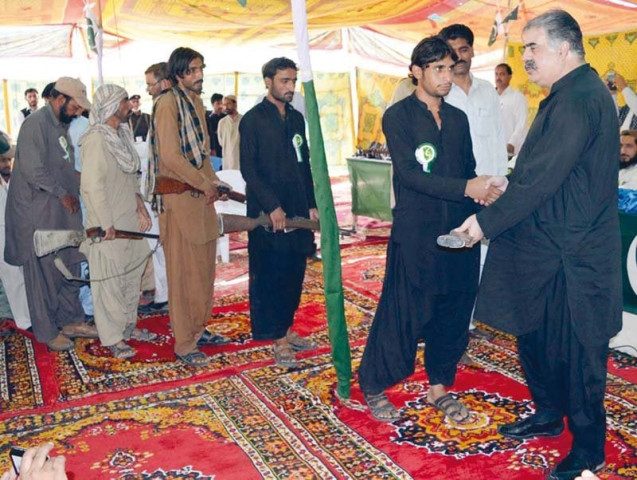 militants surrender their weapons to pml n leader sanaullah zehri in khuzdar photo express naseem james militants surrender their weapons to pml n leader sanaullah zehri in khuzdar photo express naseem james