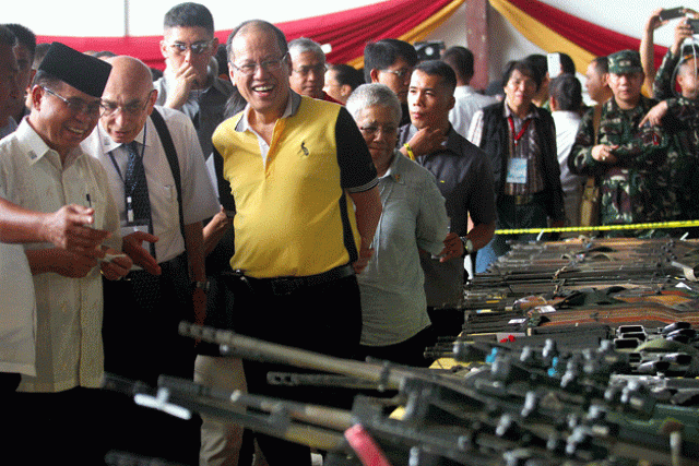moro islamic liberation front rebel group chairman murad ebrahim l and philippine president benigno aquino 3rd l in yellow inspect rebel firearms to be decommissioned during a ceremony in sultan kudarat on june 16 2015 the moro islamic liberation front retired a small group of guerrillas and handed over 75 firearms for quot decommissioning quot june 16 to prod parliament to pass a proposed law giving minority muslims self rule photo afp moro islamic liberation front rebel group chairman murad ebrahim l and philippine president benigno aquino 3rd l in yellow inspect rebel firearms to be decommissioned during a ceremony in sultan kudarat on june 16 2015 the moro islamic liberation front retired a small group of guerrillas and handed over 75 firearms for quot decommissioning quot june 16 to prod parliament to pass a proposed law giving minority muslims self rule photo afp