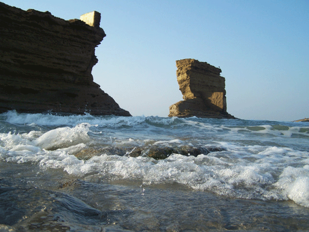 picnickers choose to ignore the ban imposed on swimming or stepping into the sea photo girl from karachi