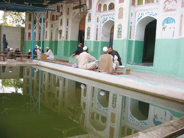 men engage in conversation in the mosque built by hafiz murad in ad 1725 photo express men engage in conversation in the mosque built by hafiz murad in ad 1725 photo express