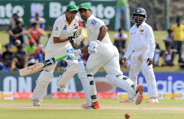 pakistan cricketers zulfiqar babar l and asad shafiq c run between wickets during the fourth day of the opening test match between sri lanka and pakistan at the galle international cricket stadium in galle on june 20 2015 photo afp