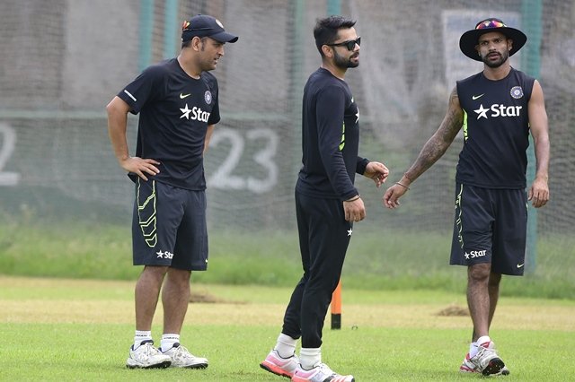 indian cricket captain mahendra singh dhoni l attends a training session with his teammates virat kohli c and shikhar dhawan r at the sher e bangla national cricket stadium in dhaka on june 17 2015 ahead of the first odi cricket match against bangladesh photo afp