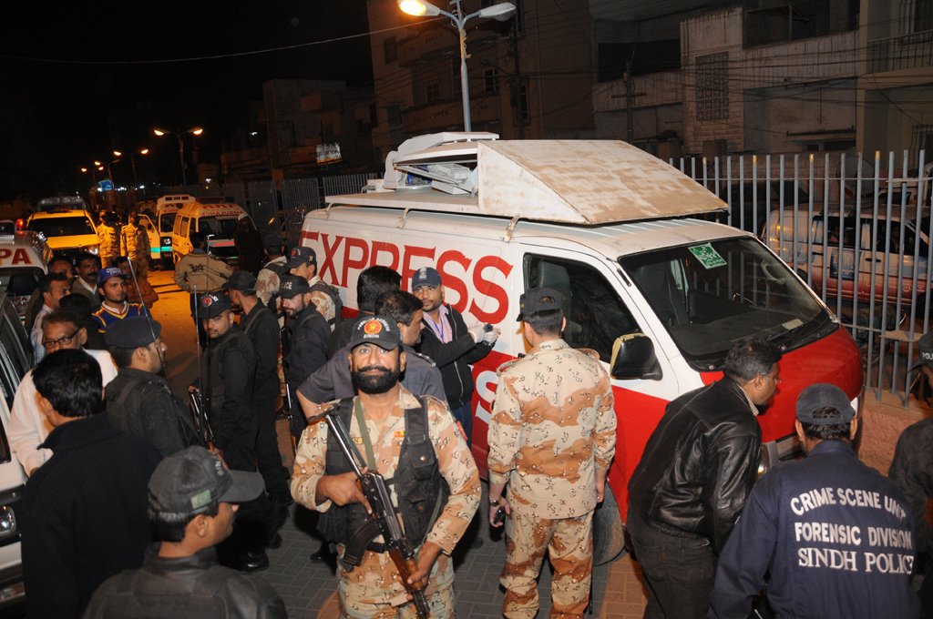 forensic experts inspecting the express news van that was attacked by the militants in karachi three media workers were also in the attack photo express mohammad noman