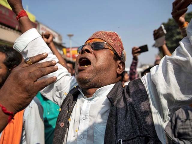 a hindu devotee celebrates after the supreme court 039 s verdict on a disputed religious site in ayodhya india photo reuters