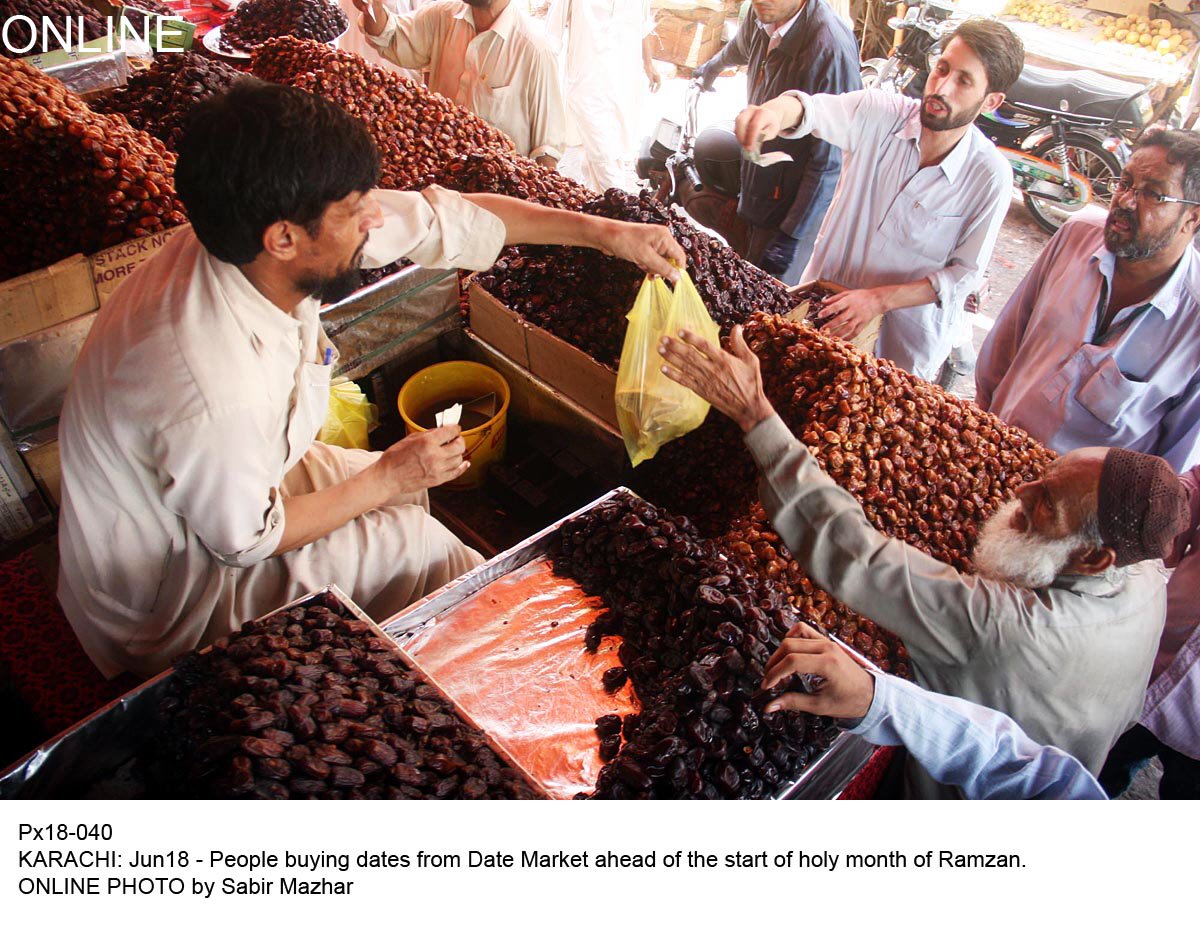 people purchase dates ahead of ramazan in karachi on thursday photo online