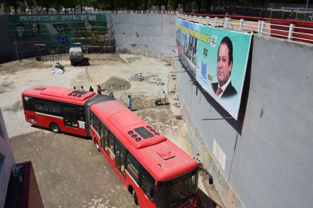 quot an underpass and a temporary overhead bridge would be constructed to connect the jinnah avenue with the blue area quot metro bus project committee chairman hanif abbasi photo afp
