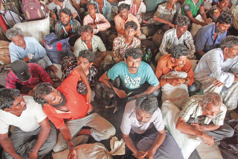 freed indian fishermen wait for transport at landhi jail photo athar khan express