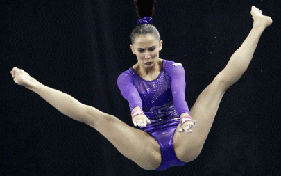 muslim gymnast criticised for revealing costume as she wins double gold