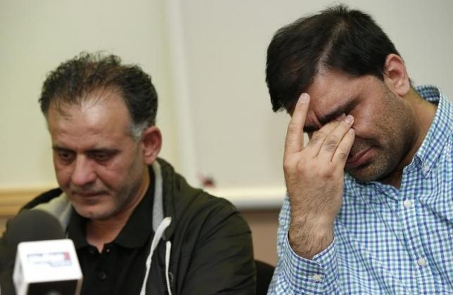 akhtar iqbal l the husband of sugra dawoodman and mohammed shoaib the husband of khadija bibi dawood react during a news conference at a solicitors office in bradford britain june 16 2015 photo reuters