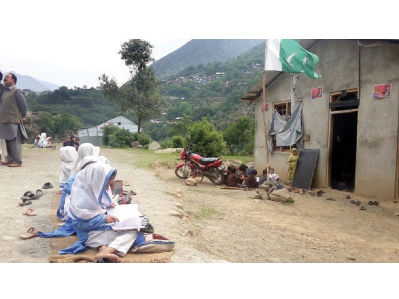 girls seen studying on the bare ground their classroom for now photo sherinzada express