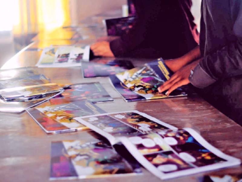 people go through the comic books created by imran azhar owner of azcorp entertainment pakistan azhar aims to inculcate positive values among children living in the juvenile jail through these books photo press release