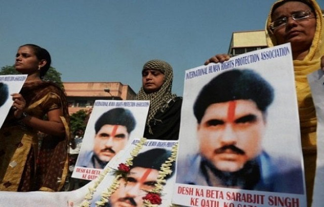 indian activists pose with pictures of late sarabjit singh as they pay tribute to him in kolkata on may 2 2013 photo afp indian activists pose with pictures of late sarabjit singh as they pay tribute to him in kolkata on may 2 2013 photo afp