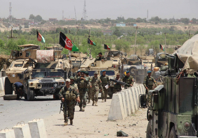 afghan troops walk in the chardarah district of kunduz province on june 21 2015 photo afp afghan troops walk in the chardarah district of kunduz province on june 21 2015 photo afp