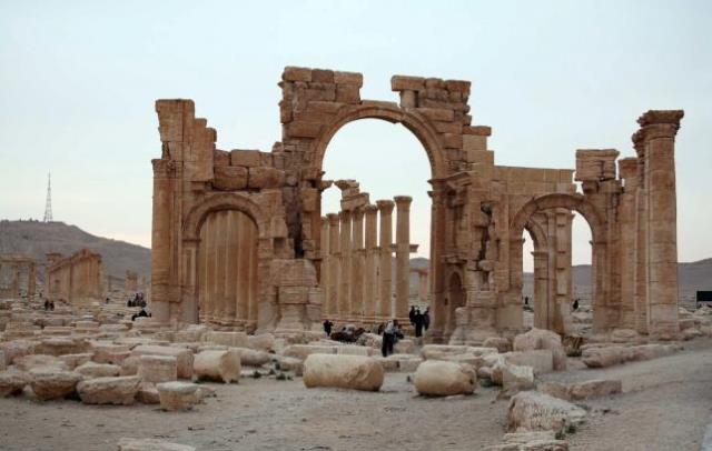 tourists walk in the historical city of palmyra april 14 2007 photo reuters