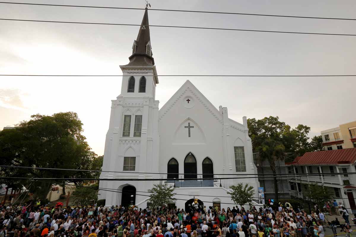 a crowd gathers outside the emanuel african methodist episcopal church following a prayer vigil nearby in charleston south carolina june 19 2015 photo reuters
