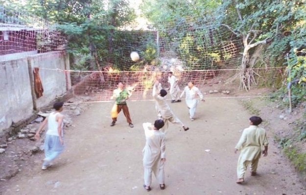 children and youth play volleyball in the streets due to absence of any playground in swat photo the express tribune