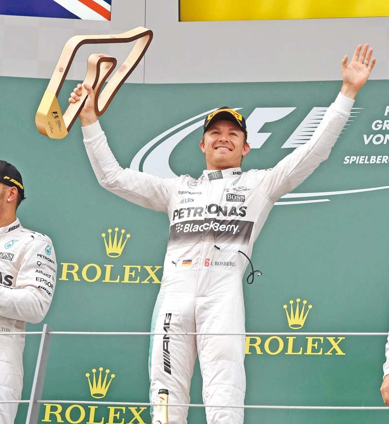 nico rosberg won the austrian grand prix for the second year in a row in a mercedes one two finish with teammate lewis hamilton who picked up a five second penalty in the race on sunday photo afp