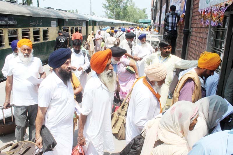 pilgrims enter the passengers lounge on arrival at the wagha border photo shafiq malik express