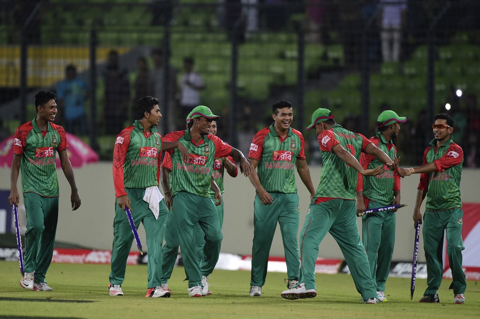 bangladesh cricketers celebrate after winning the first one day international odi cricket match between bangladesh and india at the sher e bangla national cricket stadium in dhaka on june 18 2015 photo afp