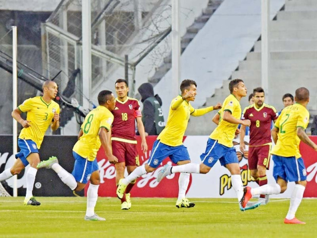 thiago silva celebrates opening the scoring in brazil s 2 1 win gesturing towards suspended skipper neymar who watched on from the stands photo afp