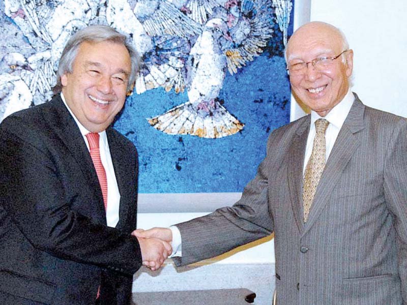 unhcr chief ant nio guterres shakes hands with prime minister s adviser on national security and foreign affairs sartaj aziz photo app