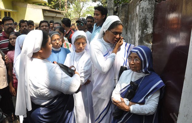 in this file photo christian nuns stand next to the convent of jesus and mary in ranaghat 70 kilometres north of kolkata as investigations continued into the gang rape of a 71 year old nun at the convent photo afp