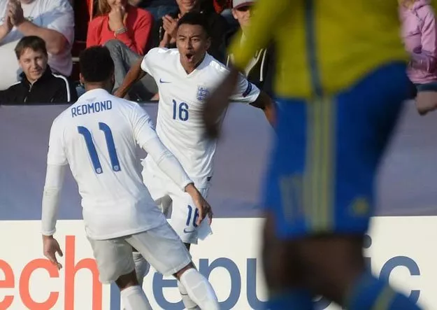 jesse lingard of england c celebrates with his teammate nathan redmond after scoring against sweden during the uefa under 21 european championship photo afp jesse lingard of england c celebrates with his teammate nathan redmond after scoring against sweden during the uefa under 21 european championship photo afp