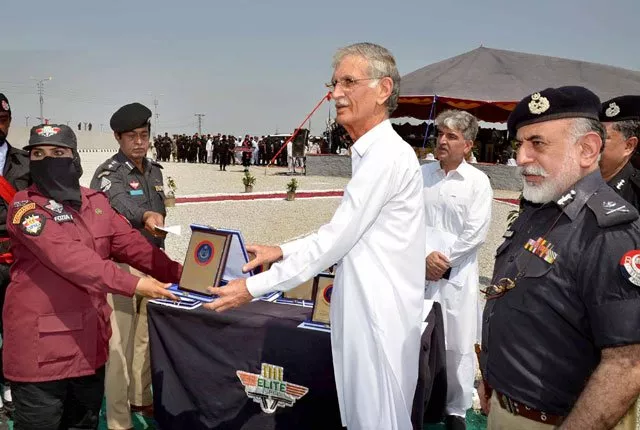 chief minister k p pervez khattak presenting the shield to a woman commando during the passing out parade of the first group of women commandos from nowshera elite force training school photo nni chief minister k p pervez khattak presenting the shield to a woman commando during the passing out parade of the first group of women commandos from nowshera elite force training school photo nni