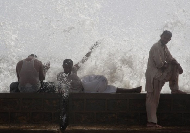 men cool off at sea view in karachi photo ap men cool off at sea view in karachi photo ap