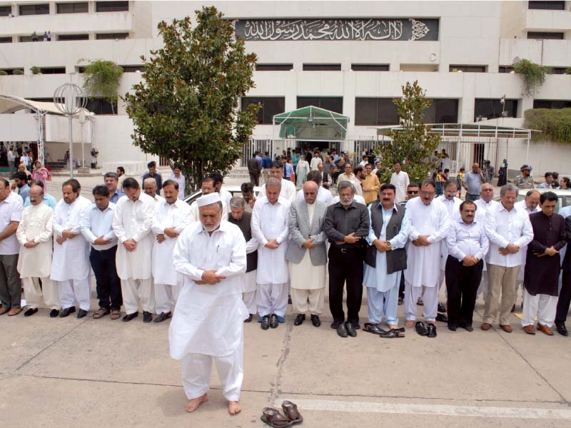 lawmakers offer funeral prayers in absentia outside the parliament house for the heatstroke victims photo afp