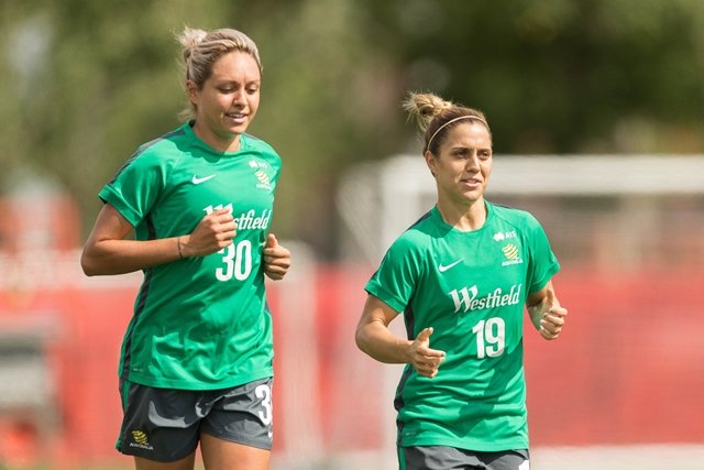 australia 039 s kyah simon l and katrina gorry jog during the team 039 s practice session in edmonton canada on june 23 2015 the australians await the result of tonight 039 s match between japan and the netherlands to learn their opponent in the quarterfinals at the fifa women 039 s world cup photo afp