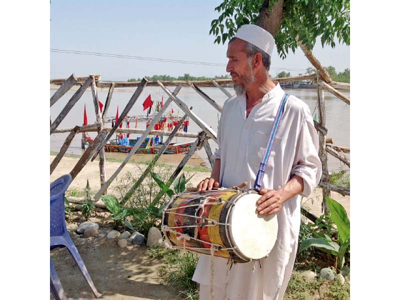 nasir khan and sareer khan play folk music at a picnic spot in charsadda photos mureeb miohmand express
