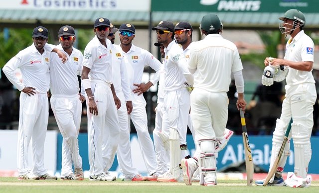 sri lankan cricketers wait for a third umpire decision against pakistan cricketer younis khan r during the opening day of the second test match between sri lanka and pakistan at the p sara oval cricket stadium in colombo on june 25 2015 pakistan captain misbah ul haq won the toss and elected to bat in the second test against sri lanka at the p sara oval in colombo photo afp