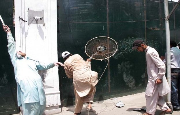 a protester smashing a fan against the pa gate photo abid nawaz express