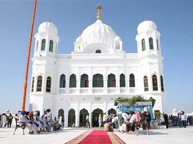 sikh pilgrims gather to offer prayers towards the temple of baba guru nanak dev photo getty sikh pilgrims gather to offer prayers towards the temple of baba guru nanak dev photo getty