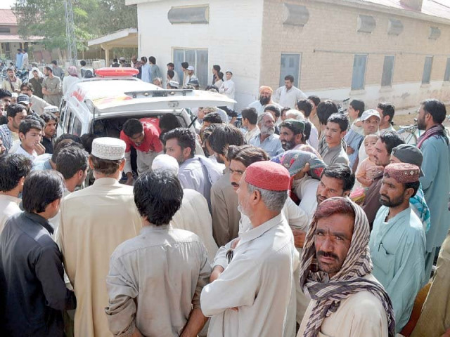 relatives gather as rescue workers shift mastung accident victims photo express relatives gather as rescue workers shift mastung accident victims photo express