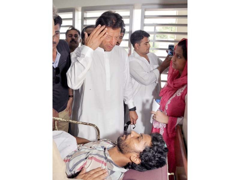 pti chief imran khan inquires about the well being of a heatstroke patient in jinnah hospital photo mohamad azeem express