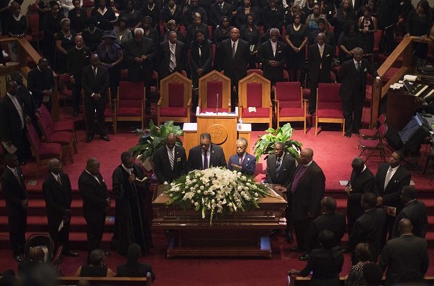 reverends al shapton 2nd r and jesse jackson c stand behind the casket holding emanuel ame church shooting victim ethel lance during her funeral at the royal missionary baptist church in north charleston south carolina june 25 2015 photo afp