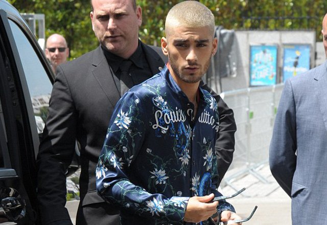 Zayn Malik wears silk shirt to Louis Vuitton show in Paris